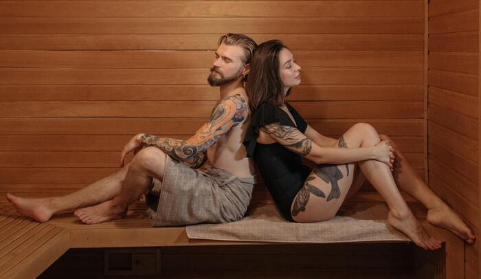 man and woman inside a sauna
