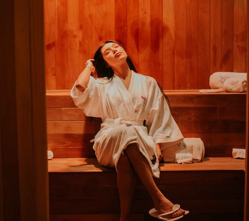 woman relaxing in a sauna