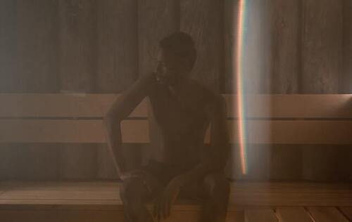 man relaxing in a sauna